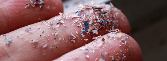 Close up shot of microplastics on finger tips