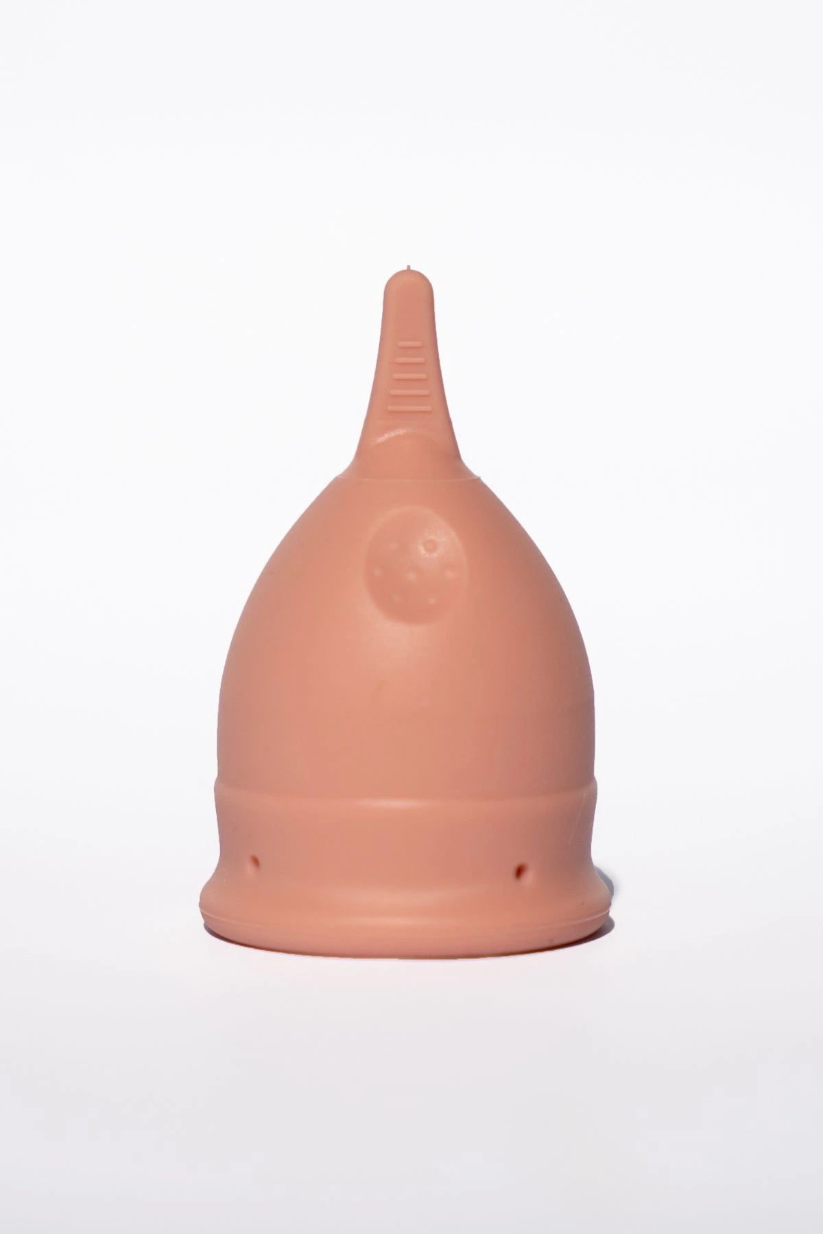 POM Finger Grip Menstrual Cup in light peach. Made from 100% medical-grade silicone, this soft, flexible cup features an easy-to-hold finger grip design for comfortable insertion and removal.