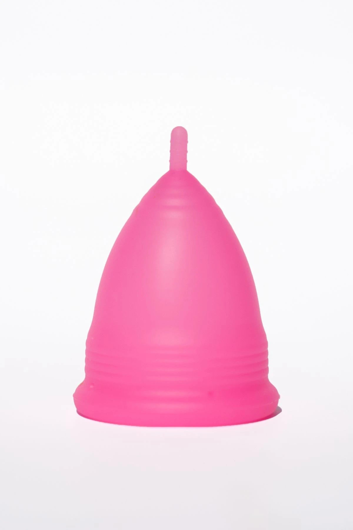 POM Super Soft Menstrual Cup in hot pink, made from 100% medical-grade silicone, featuring ribbed edges and a shorter stem for added comfort.