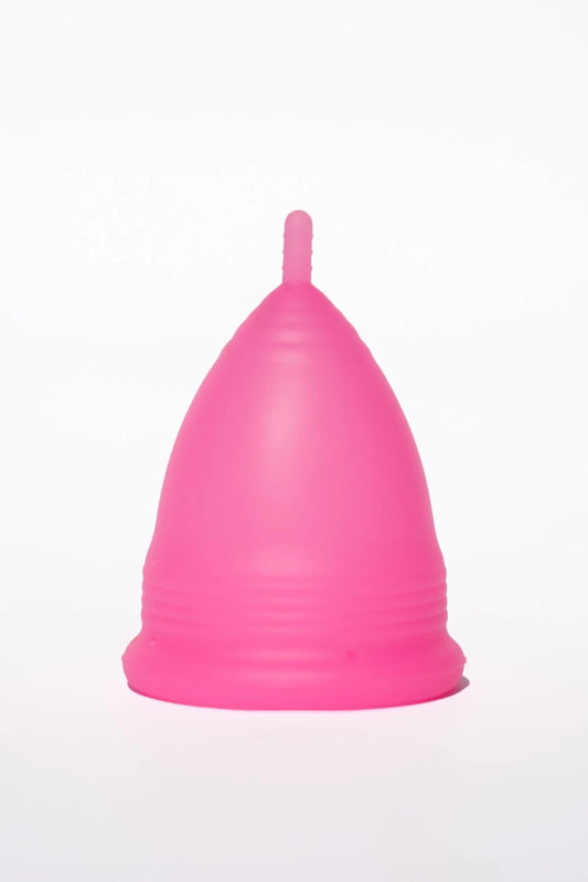 POM Super Soft Menstrual Cup in hot pink, made from 100% medical-grade silicone, featuring ribbed edges and a shorter stem for added comfort.